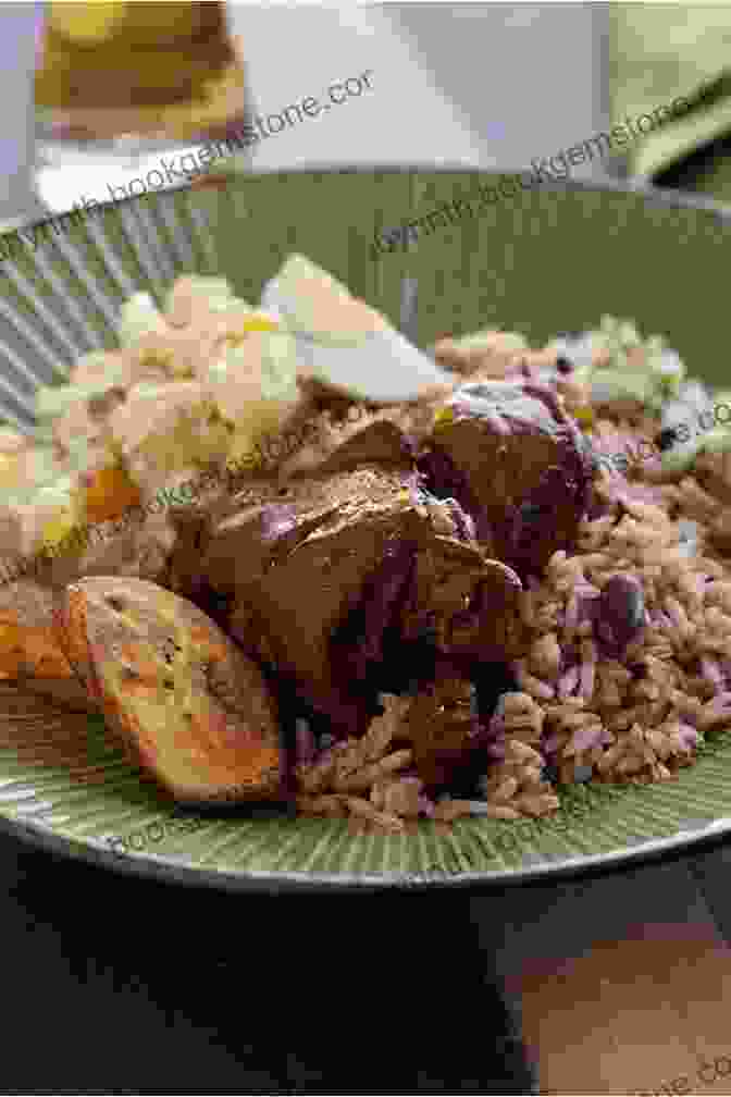 A Plate Of Rice And Beans, A Belizean National Dish Served With Stewed Chicken. Most Popular Recipes Direct From Belize: A Cookbook Of Essential Belizean Cuisine
