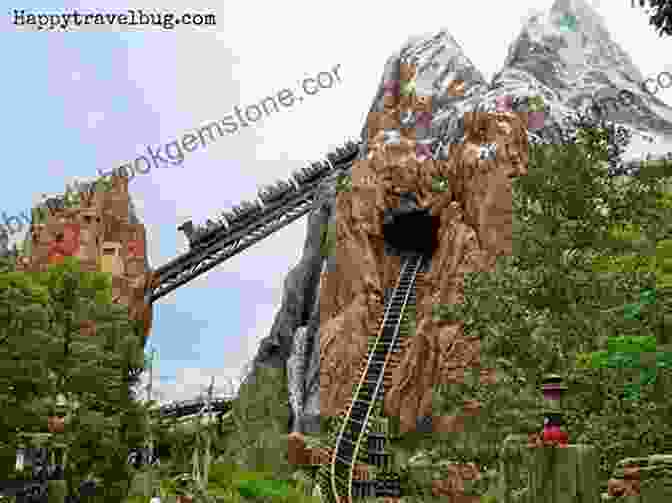 A View Of The Expedition Everest Roller Coaster At Disney's Animal Kingdom, With Its Snow Capped Peaks And Lush Greenery Surrounding It. From Adventureland To Zootopia: The Amazing Of Disney Lists